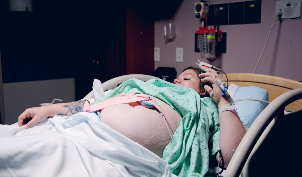 woman lying down in a hospital bed